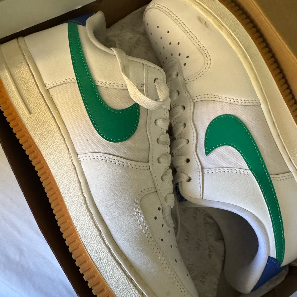 Nike Air Force’s White Sneakers with Green Swoosh and Gum Sole